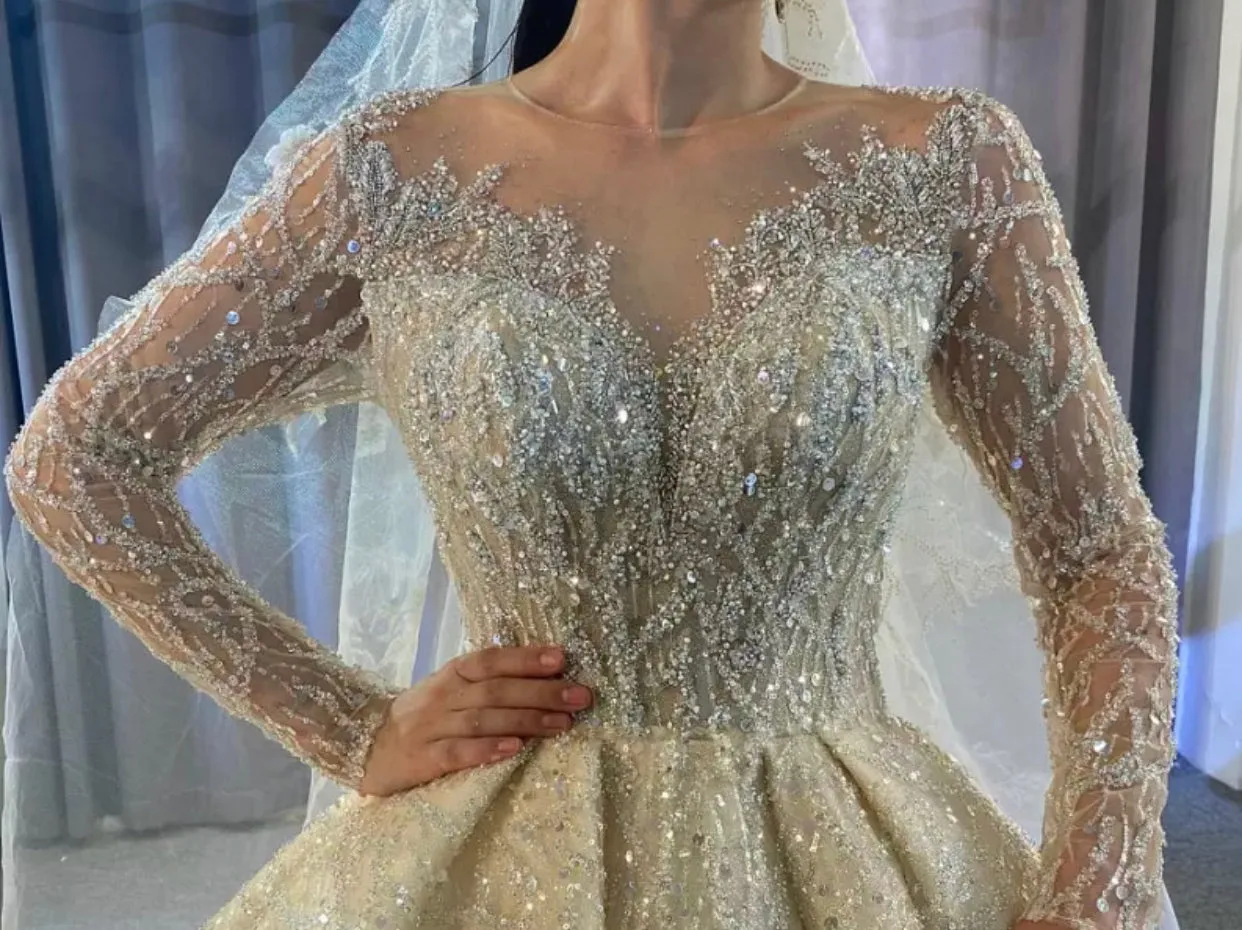 Sure! The optimized title for this e-commerce product could be Exquisite New Full Beaded Luxury Wedding Gown.